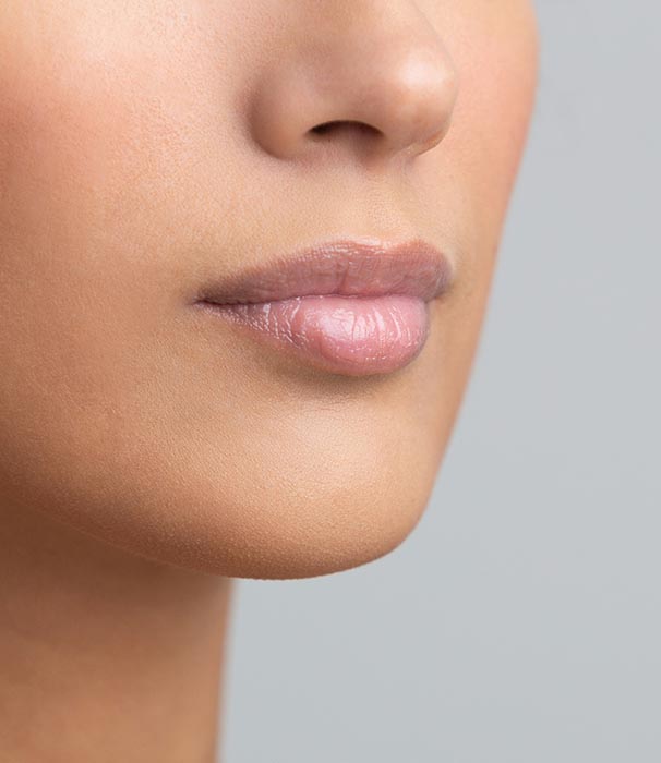 Perfect natural lip makeup, grey studio background